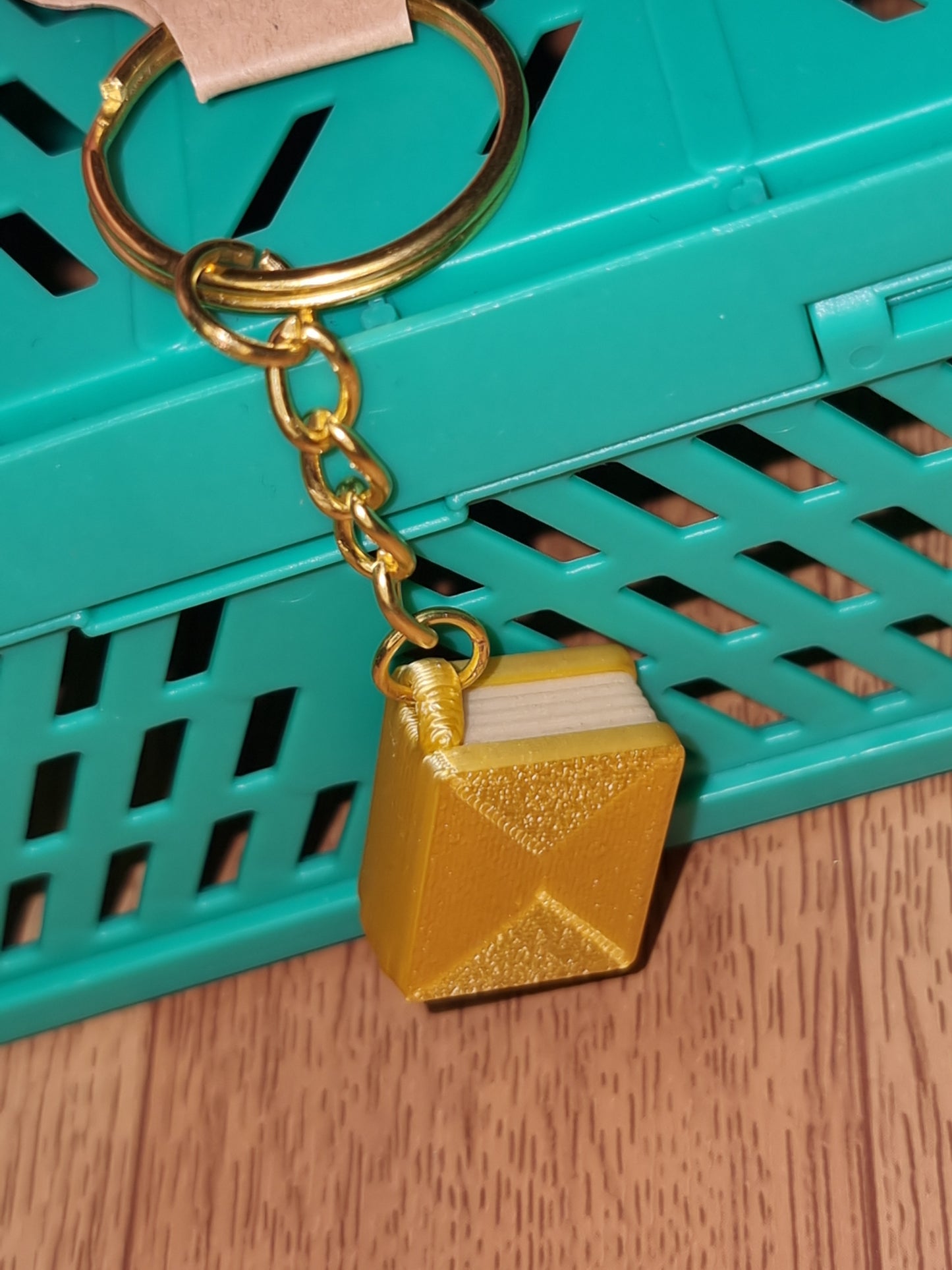 A unique 3D printed book keyrings with intricate details, perfect for book lovers.