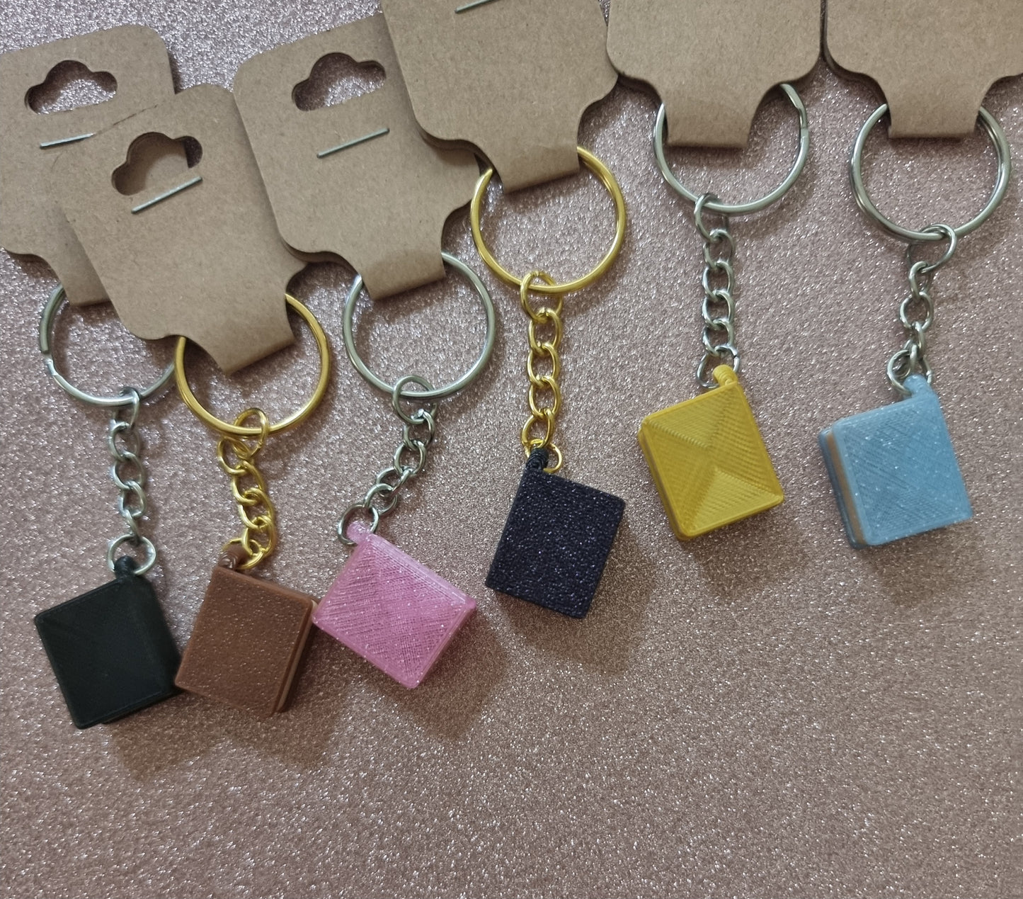 A unique 3D printed book keyrings with intricate details, perfect for book lovers.
