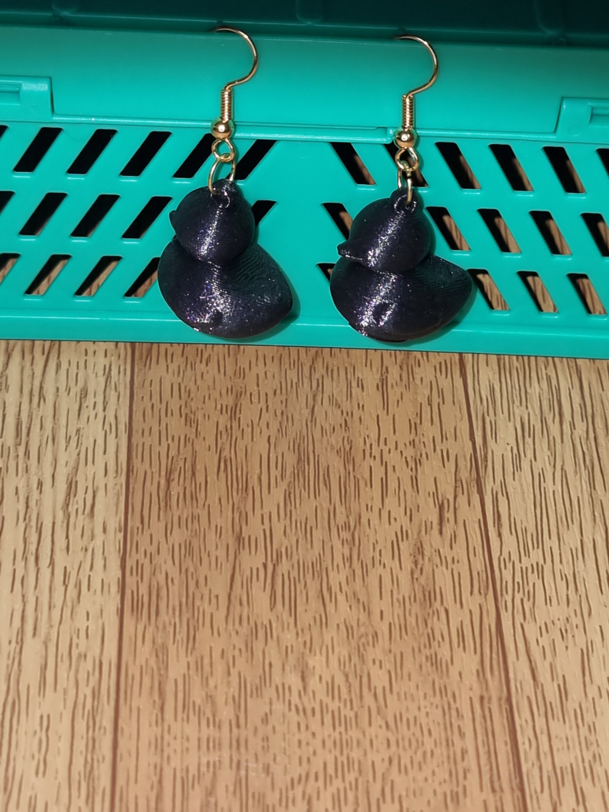 Pair of unique 3D printed duck earrings with intricate details, perfect for adding a whimsical touch.