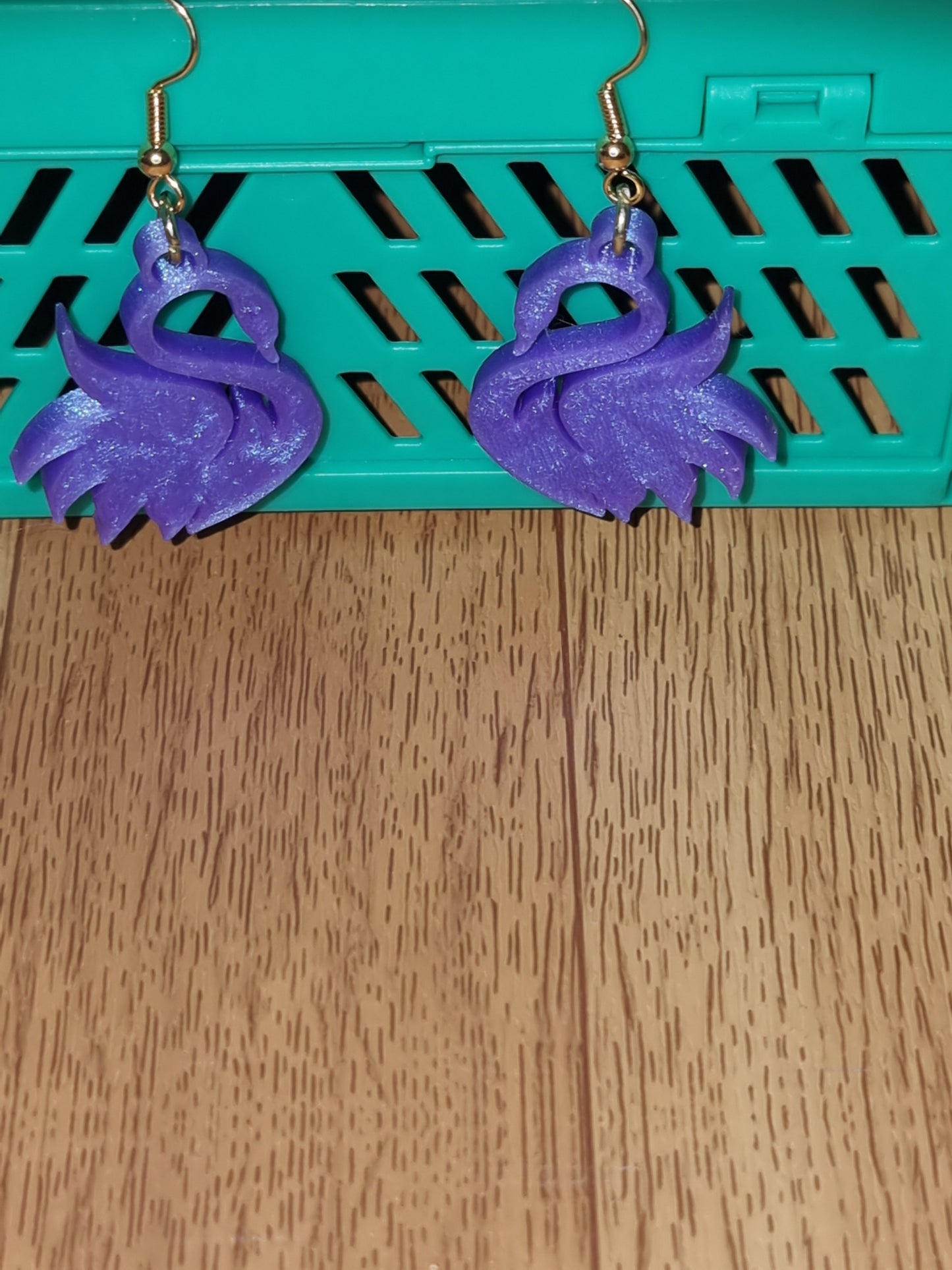 Pair of unique 3D printed swan earrings, perfect for adding a whimsical touch.