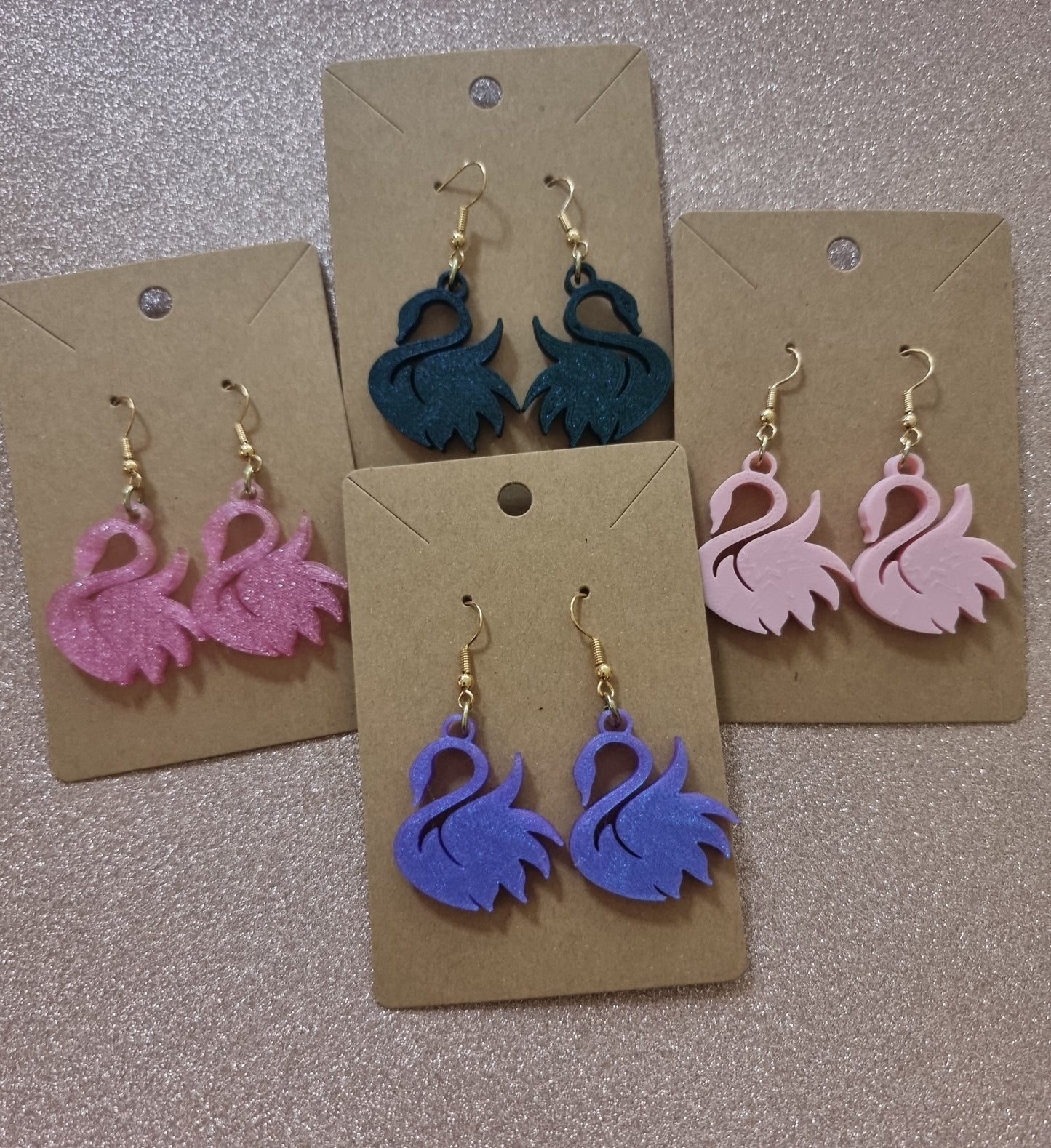 Pair of unique 3D printed swan earrings, perfect for adding a whimsical touch.