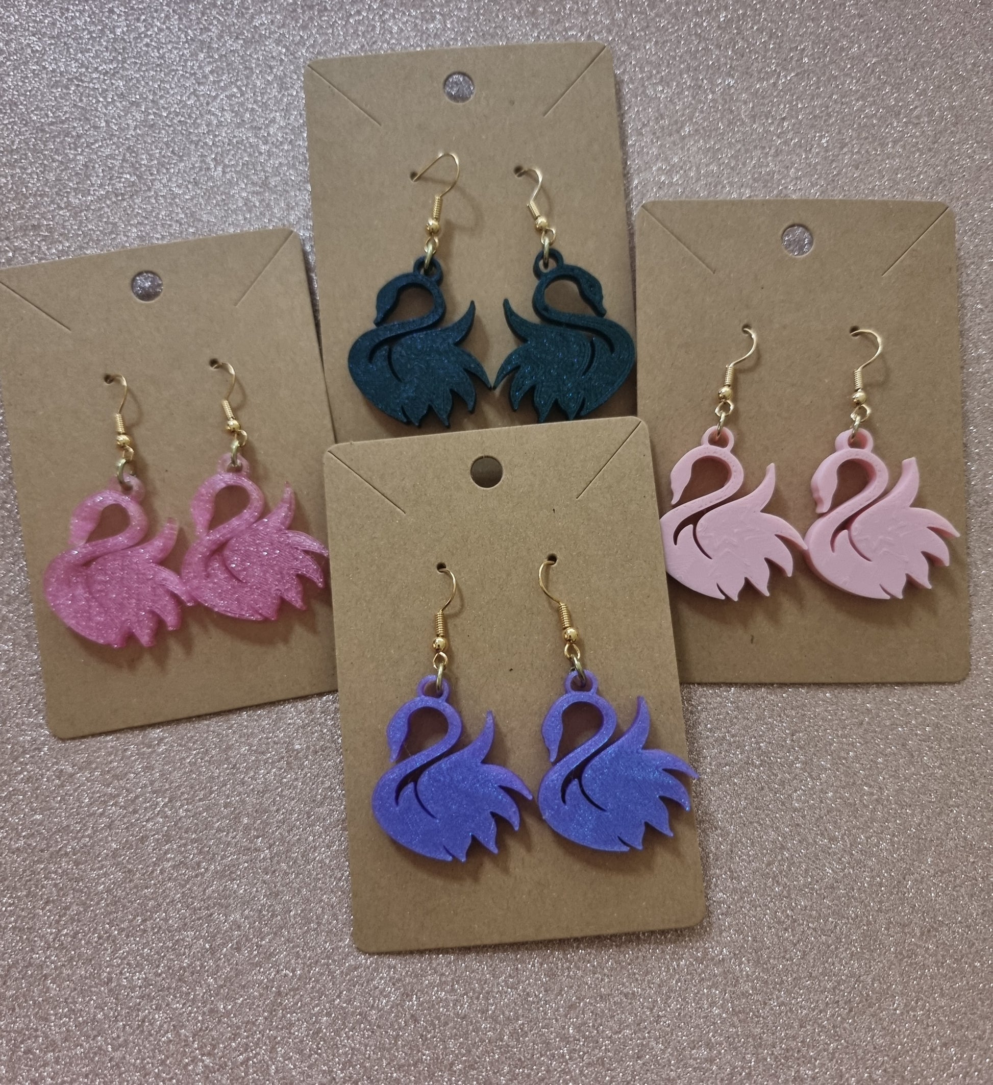 Pair of unique 3D printed swan earrings, perfect for adding a whimsical touch.
