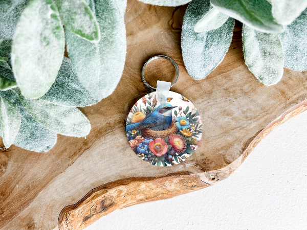 Lightweight double-sided MDF keyring featuring a Blue Wren with Australian natives on both sides, a charming personal accessory.