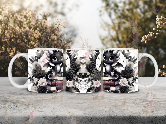 White ceramic coffee mug with a captivating black and white sublimation print of a dragon sitting on books, framed by a moon and flowers, great for your morning brew.