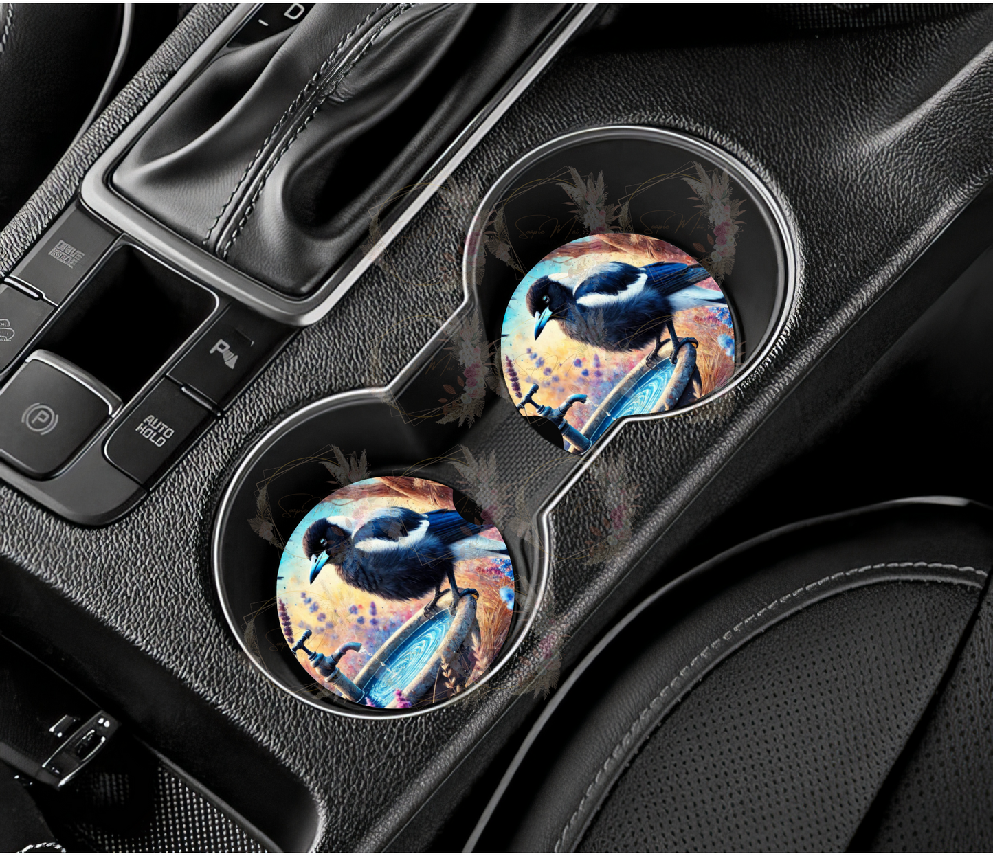 Pair of absorbent car coasters featuring a striking Australian Magpie on a birdbath design, protecting your vehicle's cup holders.