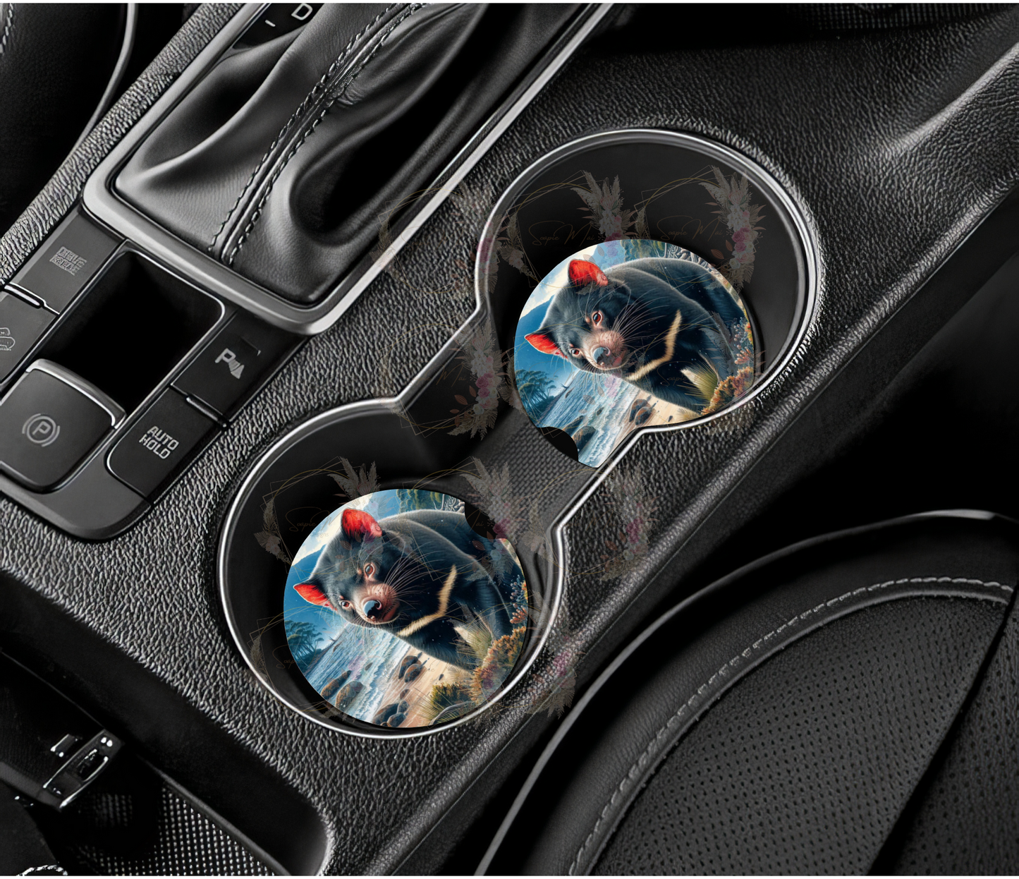 Pair of absorbent car coasters featuring a powerful Tasmanian Devil design, protecting your vehicle's cup holders.