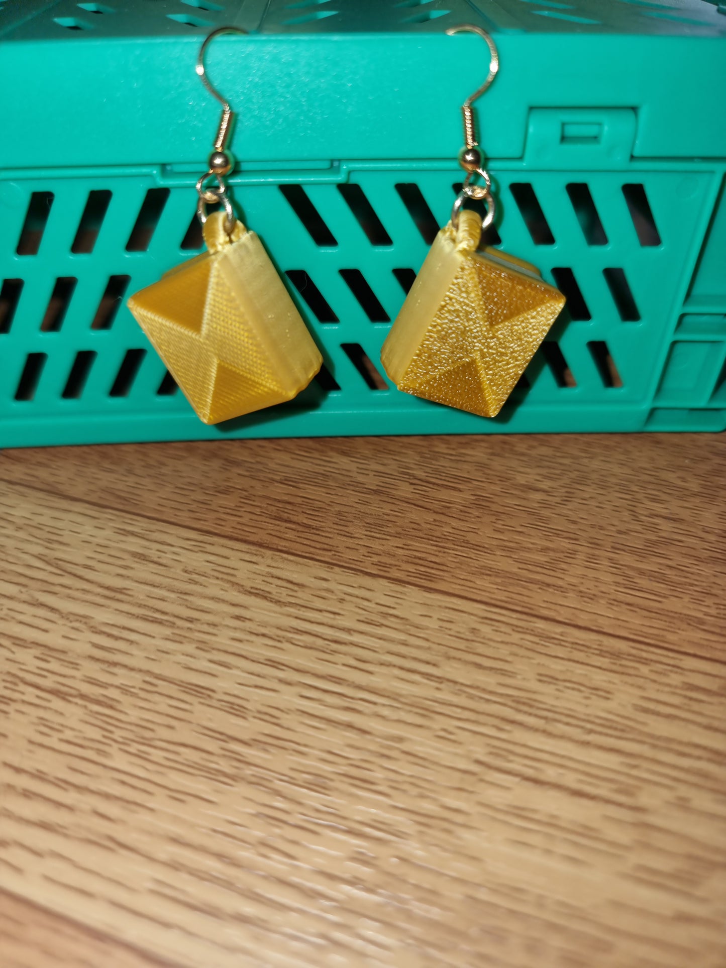 Pair of unique 3D printed book earrings with intricate details, perfect for book lovers.