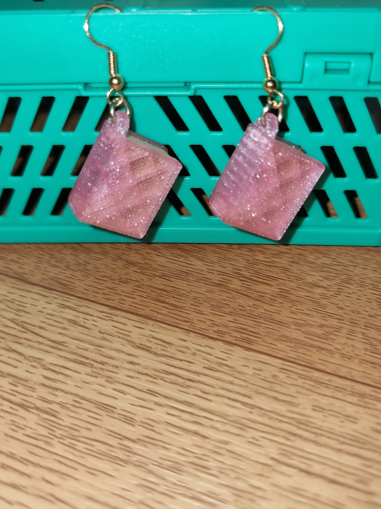 Pair of unique 3D printed book earrings with intricate details, perfect for book lovers.