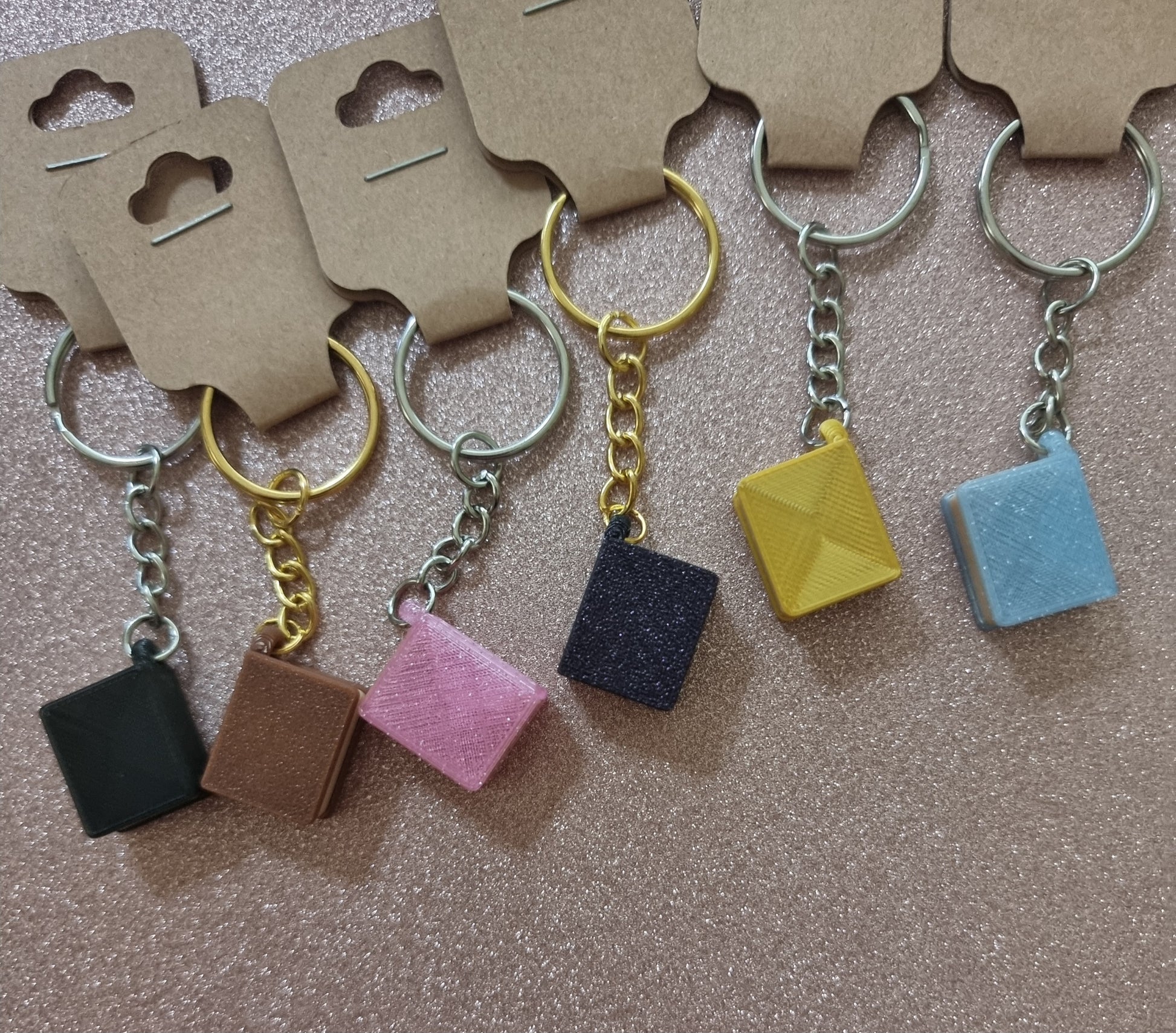 A unique 3D printed book keyrings with intricate details, perfect for book lovers.