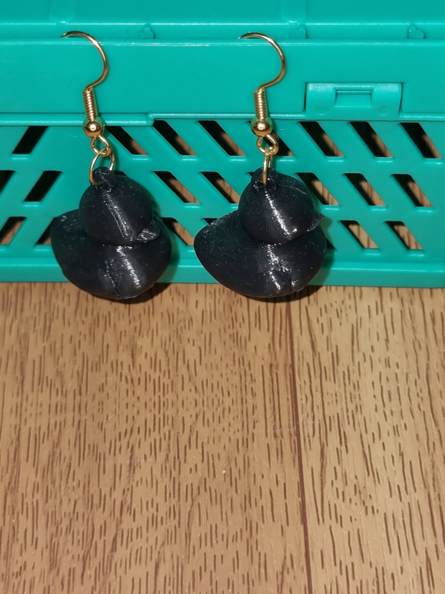 Pair of unique 3D printed duck earrings with intricate details, perfect for adding a whimsical touch.