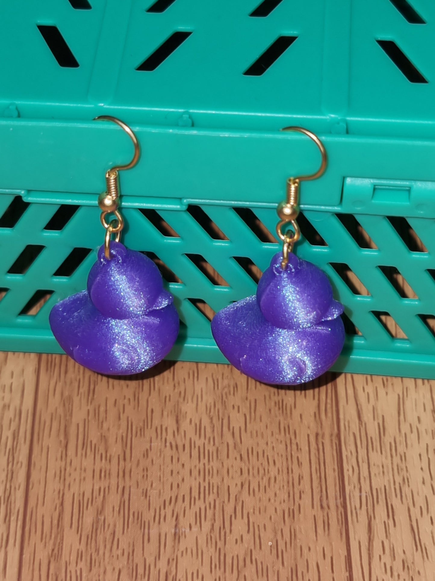Pair of unique 3D printed duck earrings with intricate details, perfect for adding a whimsical touch.