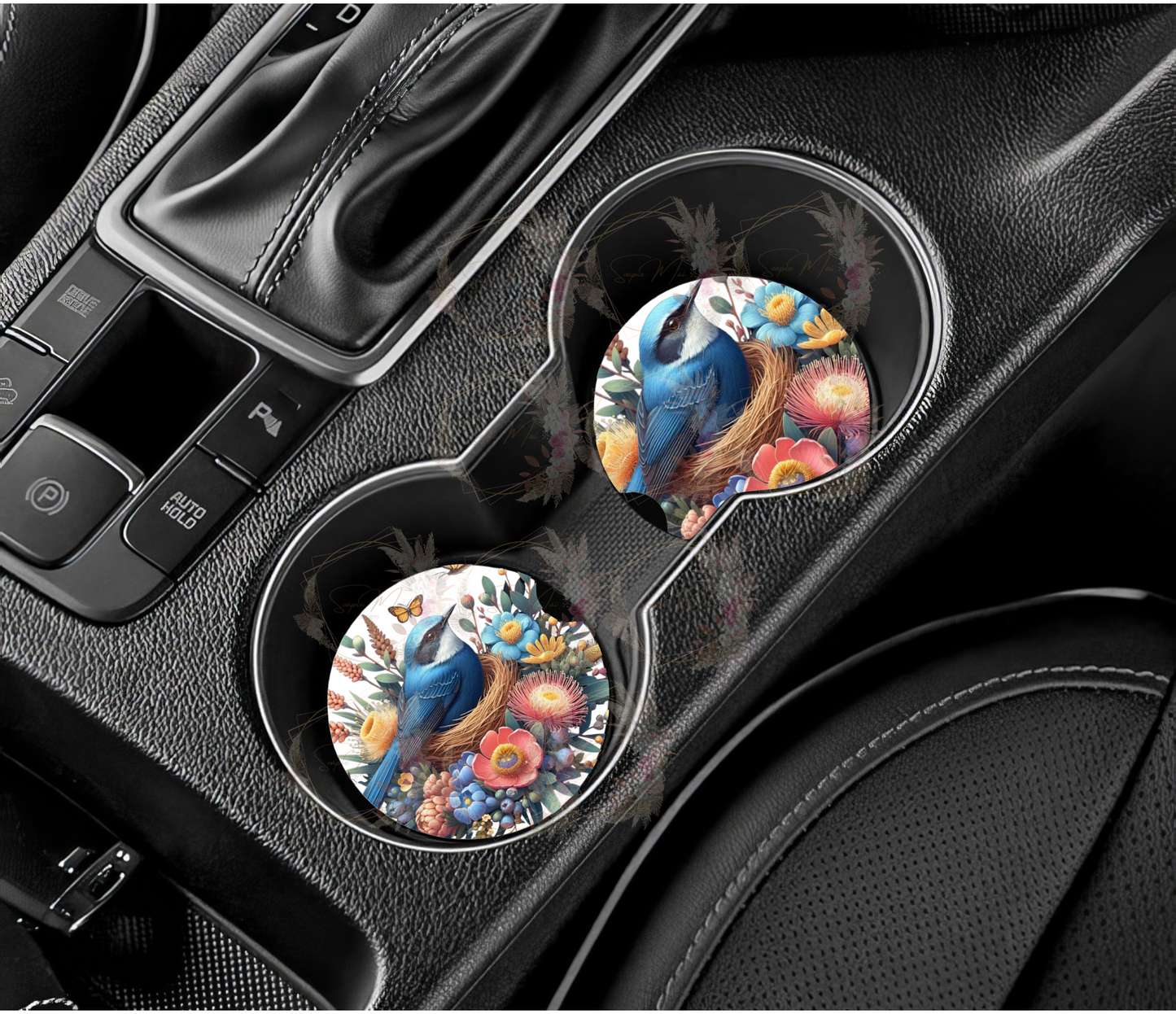 Pair of absorbent car coasters featuring a sweet Blue Wren with Australian natives design, protecting your vehicle's cup holders.