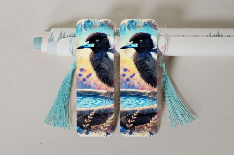 Durable double-sided aluminum bookmark showcasing an Australian Magpie on a birdbath design, perfect for avid readers